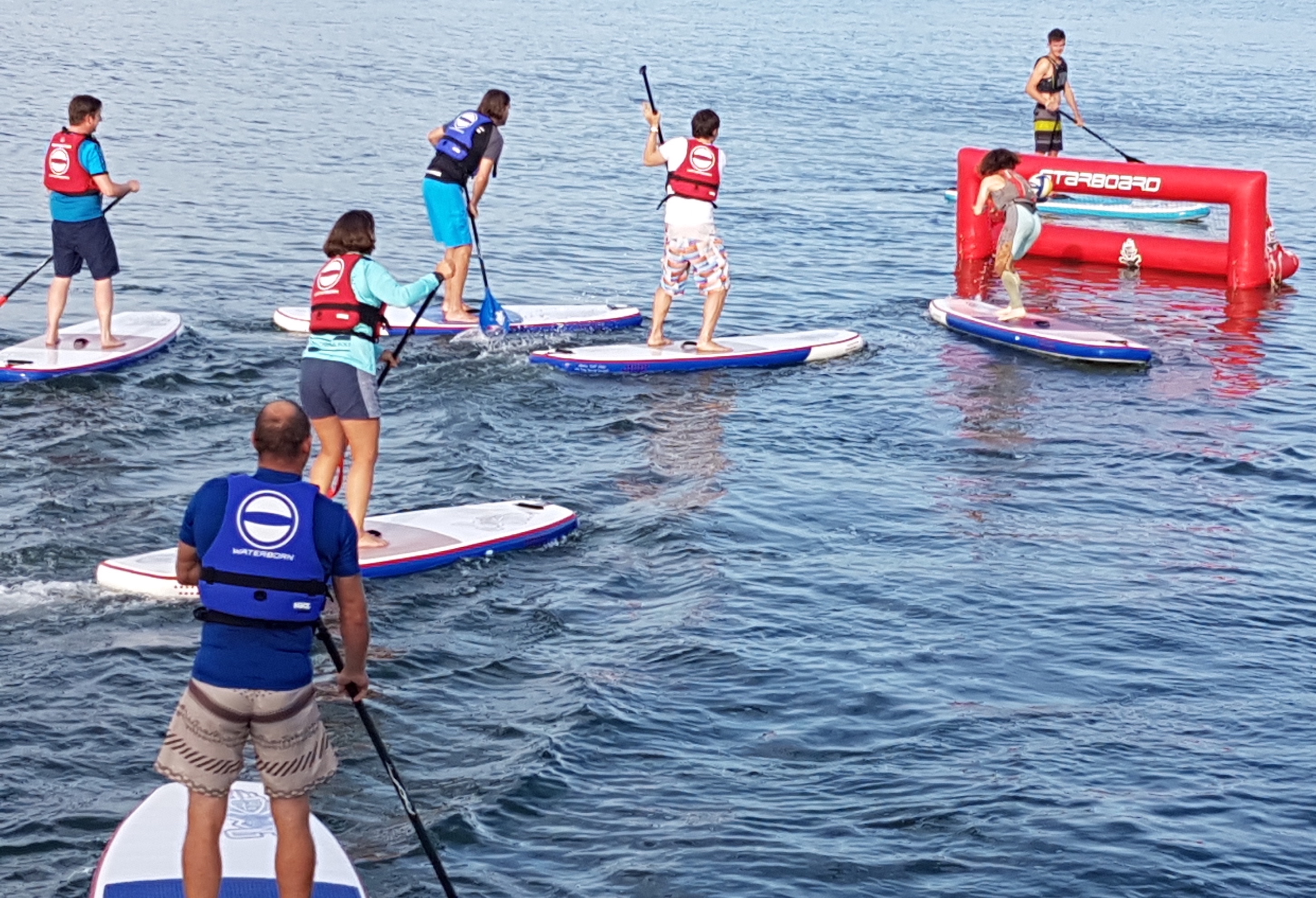 Group SUP water polo paddle boarding with Waterborn SUP